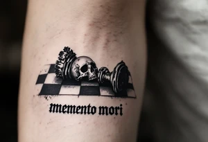 A chessboard with a fallen black king piece shaped like a skull, with "memento mori" in elegant black Gothic lettering across the board’s edge. tattoo idea
