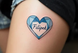 A two-tone heart, half sky blue and half white, featuring the name Filípek. tattoo idea