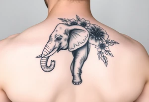 Elephant with flowers on the arm tattoo idea