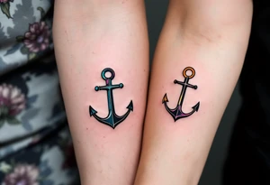 Matching man and woman tiny black anchor tattoos, the father’s on the upper arm tattoo idea