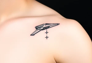 Shoulder tattoo of a spaceship and a star. tattoo idea