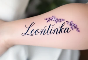 Leontýnka written in elegant script, surrounded by delicate lilac vines with small white blossoms. tattoo idea