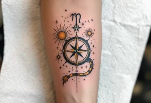 A vintage-style celestial tattoo featuring Sagittarius stars constellation, a compass, and golden sunbursts on a parchment-colored background. tattoo idea