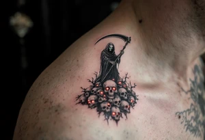 A black-and-gray Reaper with deep green eyes standing atop a pile of glowing red skull tattoo idea