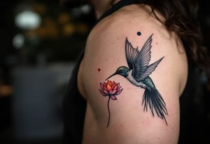 A hummingbird drinking from a lotus flower with one wing made of light (sun disc) and the other made of shadow (crescent moon) (red and black only) tattoo idea