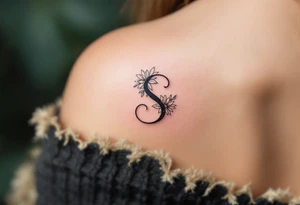 A minimalist black "S" outlined with fine-line flowers in soft pastel tones on finger. tattoo idea