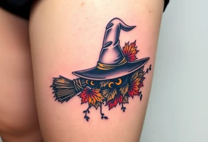 Which is broom with handle
 a witches hat with fall maple leaves and vines tattoo idea