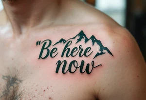 “Be here now” in deep forest green sans serif, with mountain outlines in cool slate. tattoo idea