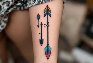 Tribal-style arrows in black with colored tips on the forearm point toward your shared journey. tattoo idea
