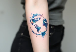 A vibrant watercolor Earth tattoo in shades of blue and green splashes across the forearm like a painter’s globe. tattoo idea