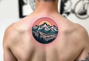 A circle filled with gradient mountain layers in tones of gray, navy, and moss green. tattoo idea