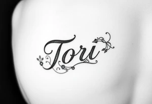 The name Tori on a man’s hand with designs tattoo idea