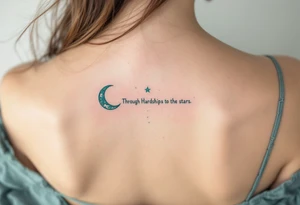 Flowing in teal ink across the spine, “Through Hardships to the stars” is crowned with a crescent moon. tattoo idea