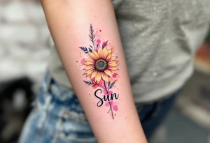 Word "Sun" written vertical with small sunflower in pink tattoo idea