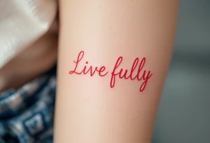 “Live fully” in bright coral ink, with yellow sun rays stretching outward. tattoo idea