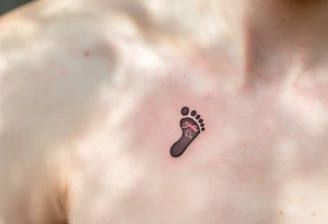 A tiny footprint in soft gray with a pink ribbon tied around it, personalized with a birthdate Lena 26. 03. 2019. tattoo idea