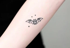 Small bat flying in front of stars tattoo idea