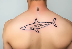 Small Whale shark on back by spine with the words “do you know why a shark keeps moving”wrapped around the shark tattoo idea