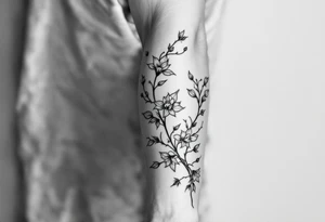 starting from a band mid-forearm, a sleeve of holly flowers and daffodils tattoo idea