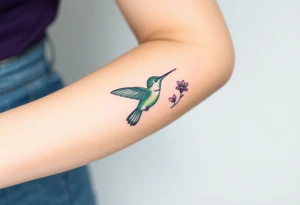 A hummingbird in iridescent green and blue shades, hovering near a blossoming flower, embodying endurance and positivity tattoo idea