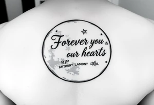 Big half moon with writing inside saying Forever in our hearts  with stars 
RIP 
ANTHONY LAMONT DEAL tattoo idea