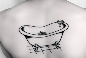 clawfoot bathtub with visible tile bathroom floor and a small bouquet of flowers on the floor tattoo idea