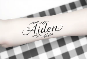 The name Aiden with a love theme
 around it for the forearm tattoo idea