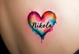 A colorful mini splashed heart, with vibrant hues of red, pink, blue, and yellow, and the name "Nikola" boldly displayed in a black modern sans-serif font. tattoo idea