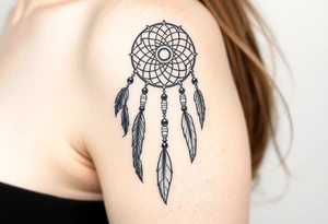 native dreamcatcher with flowing feathers and sacred beads tattoo idea