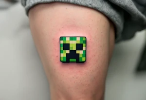 Small green Minecraft creeper head block smaller more vibrant colors tattoo idea