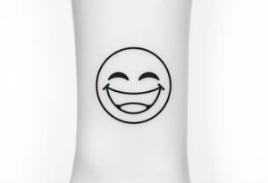 Laughing emoji with stiches tattoo idea