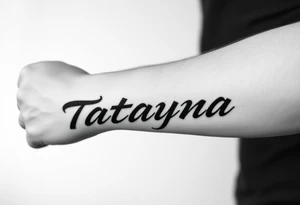 Tattoo for a man that says the name “Tatayana” tattoo idea