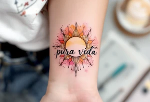 Boho-style “Pura Vida” with a mandala sun in ochre, terracotta, and soft pink behind it. tattoo idea