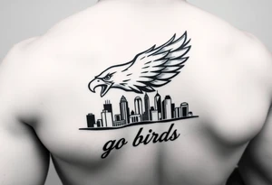 Philadelphia Eagle classic logo flying over Philadelphia city skyline with the words go Birds under it on bicep tattoo idea