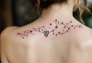 The Virgo glyph in black anchors a trail of pastel-colored stars that form the constellation on the upper spine. tattoo idea