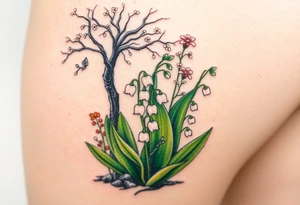 White lily in the valley bells  next to other different colored lilie plants planted underneath a blooming hawthorn tree tattoo idea