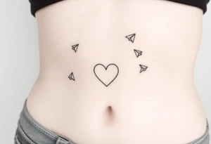 Leann going down ribs with heart and paper planes tattoo idea