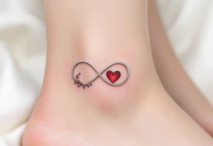 A silver infinity symbol with a deep crimson heart woven into one side. tattoo idea