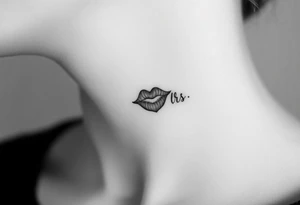kiss mark tattooed on the neck with the initials lrs beside it tattoo idea