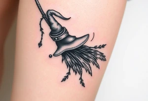 Which is broom with a witches hat with vines and feathers 
Smaller broom with hat placed on top or in the middle
Feminine and on a leg tattoo idea