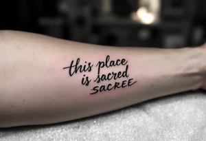 Hand written writing that says “this place is sacred” tattoo idea