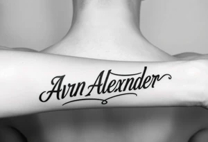 Name tattoo that says Evan Alexander with a crown on forearm tattoo idea