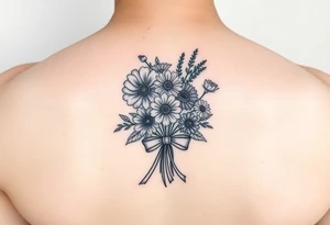 A small bouquet where the carnation, larkspur, daisy, and aster are gathered together at the stems and tied with a flowing ribbon bow tattoo idea