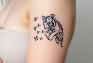Tiger cub playing with butterflies tattoo idea
