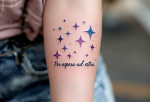 A celestial forearm piece features “Per aspera ad astra” in silver cursive beneath blue-and-purple watercolor stars. tattoo idea