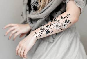 starting from a band mid-forearm, a sleeve of holly flowers and daffodils tattoo idea