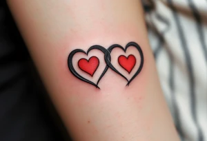 A matching couple’s design: black infinity loops with mirrored crimson hearts in the center. tattoo idea