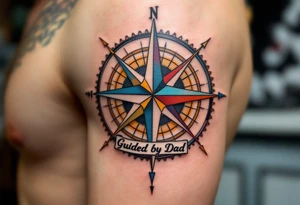 A colorful compass rose with “Guided by Dad” lettered in black under the north point. tattoo idea