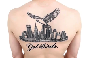 Philadelphia Classic bird flying over Philadelphia city skyline with Go Birds written under it tattoo idea