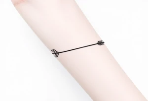 Realistic arrow tattoo idea